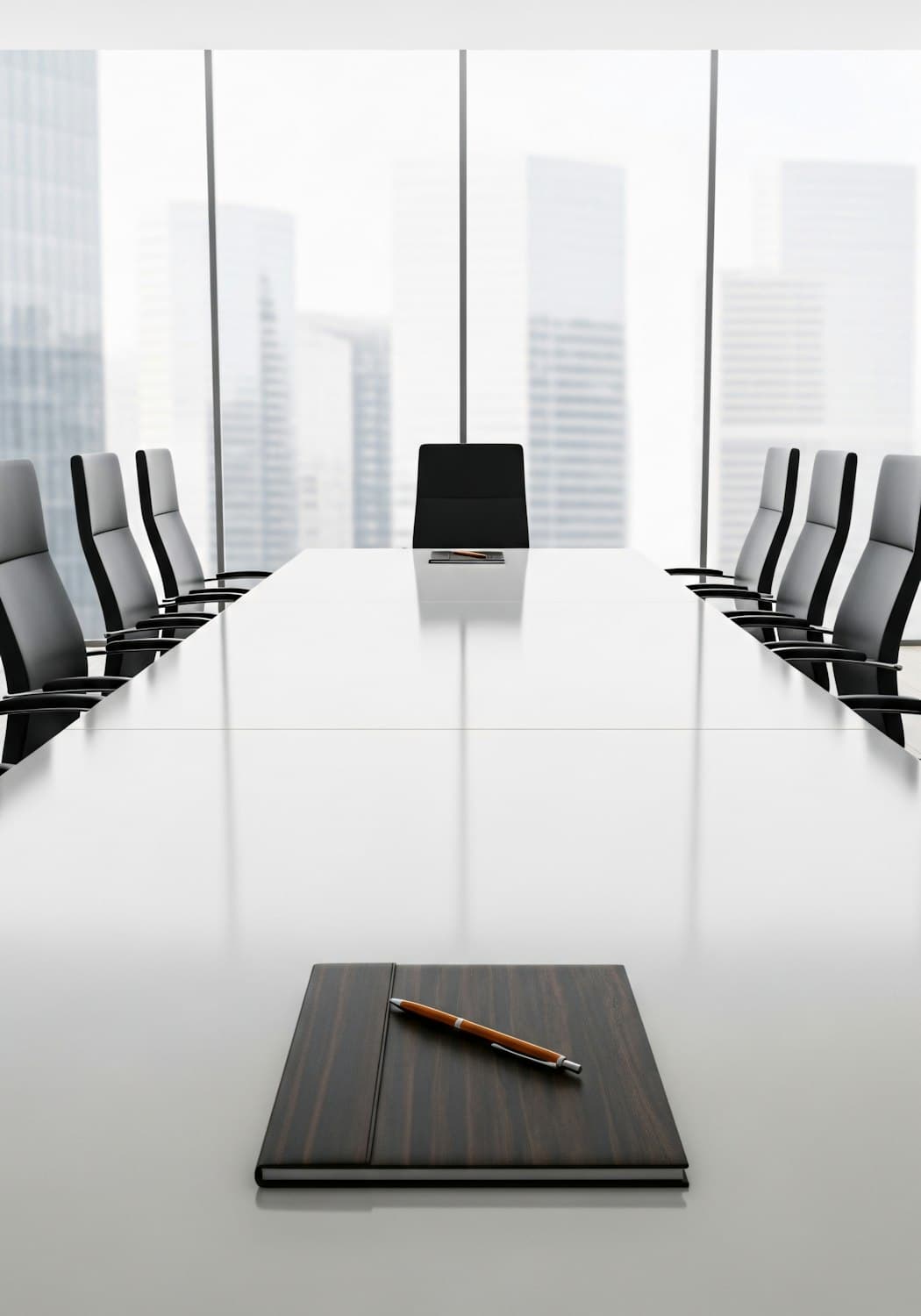 Boardroom with a long white table and city views